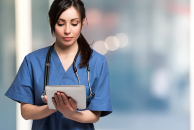 nurse using a tablet